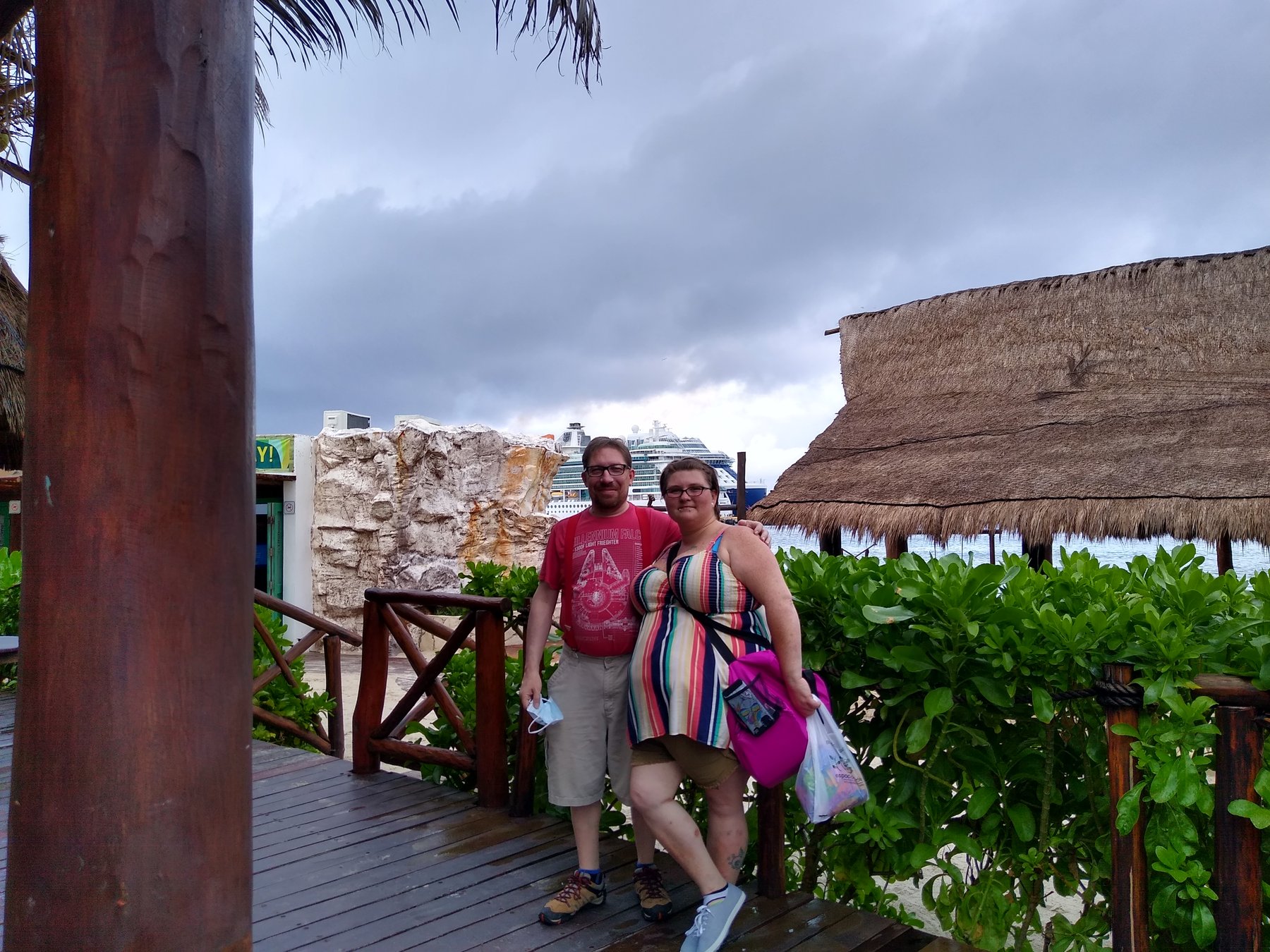 Joe and Christy in the Costa Maya port area with Serenade of the Seas visible behind them.