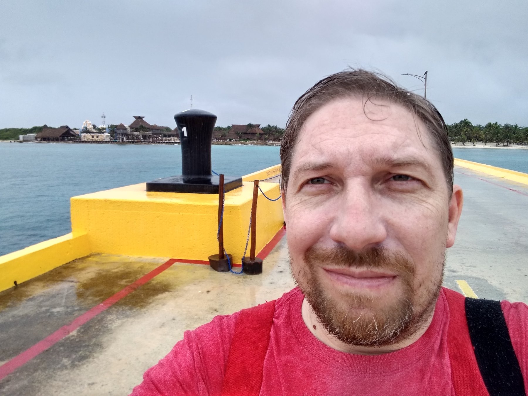 Joe on the pier in Costa Maya with the port area behind him.